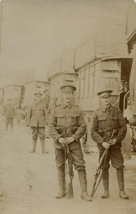 Unused black and white photographic postcard of B-type buses requisitioned for military use, 1914